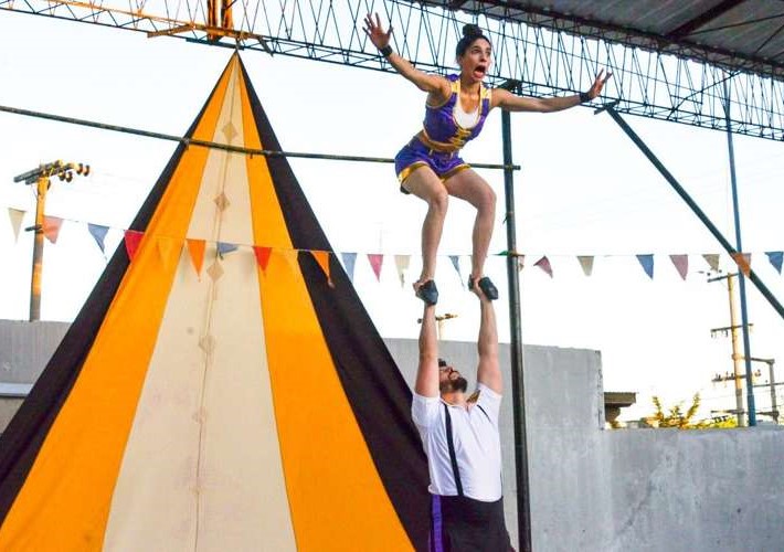 A duo performing an acrobatic stunt